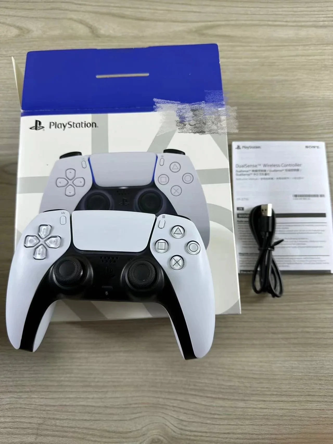 A game controller, box and cable shown in a W2C listing photo.