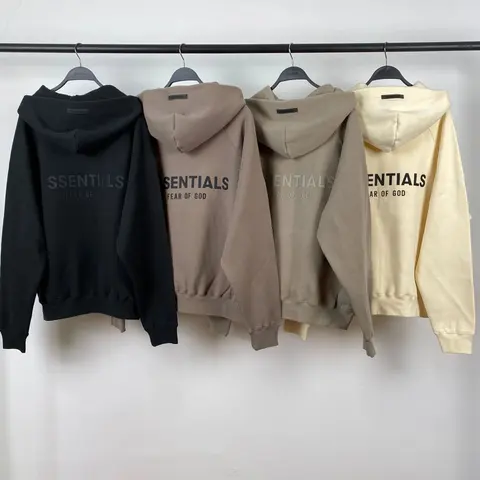 Four hoodies in dark and neutral colours hanging in a W2C listing photo.