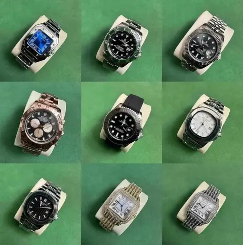 Nine watches arranged on a green background in a W2C listing photo.